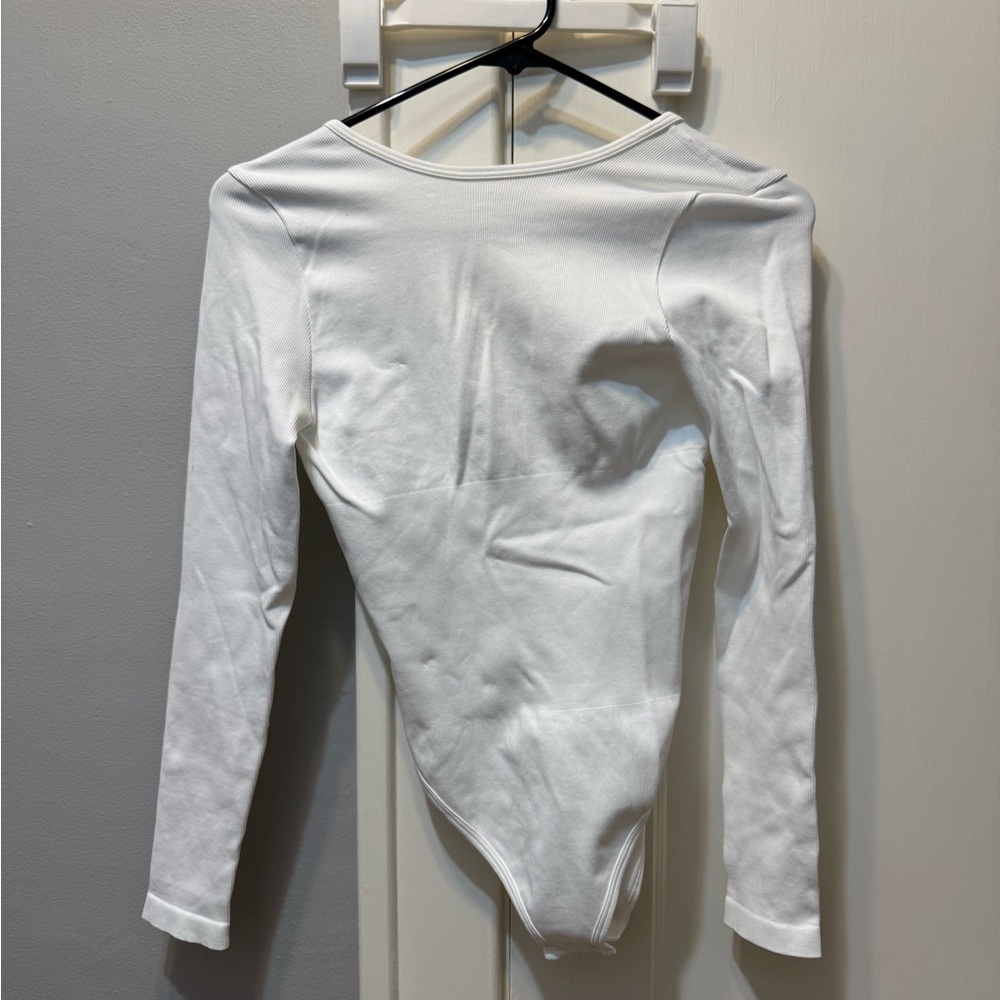 OQQ backless ribbed White Long Sleeve Bodysuit